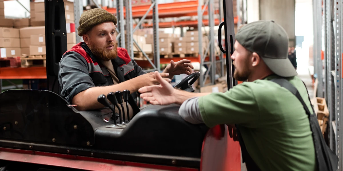 Delivery drivers talking about warehouse logistics