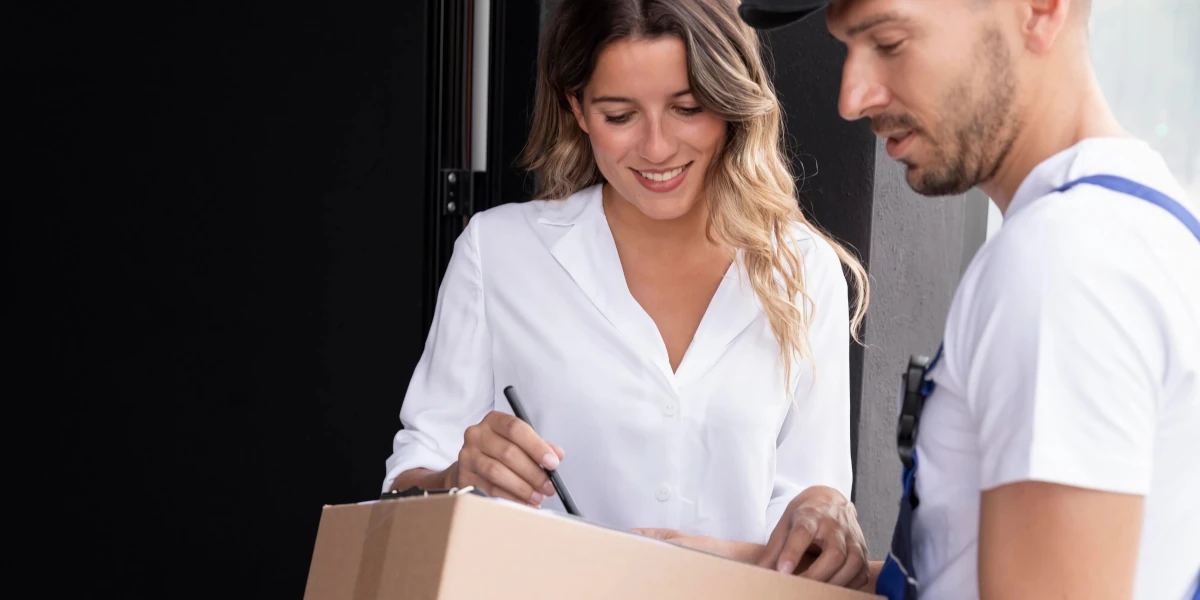 Delivery man delivering order to woman