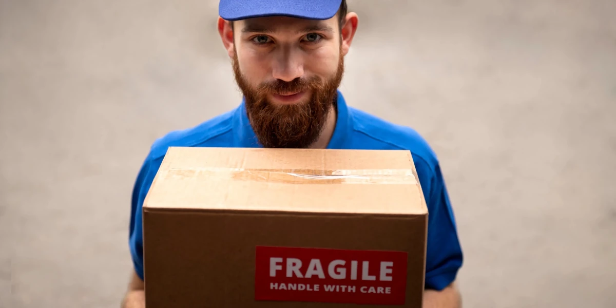 Delivery man holding a box