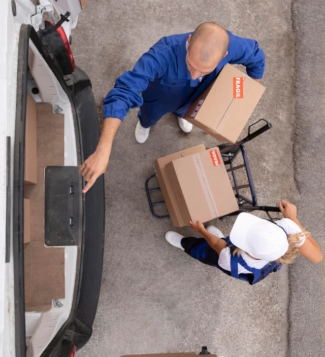 People unloading boxes from a truck 2